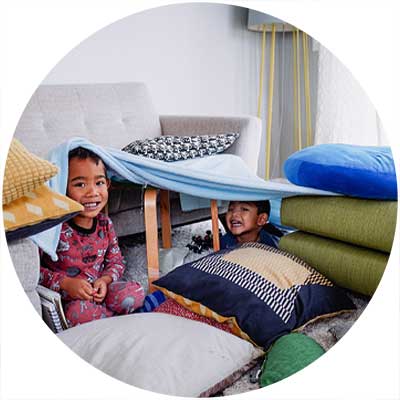 kids playing in pillow fort