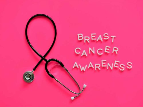 Breast cancer awareness with stethoscope on pink background