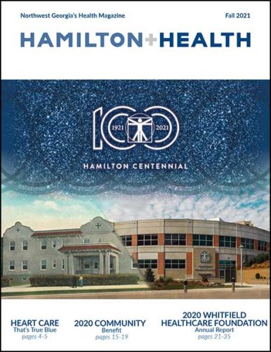 Magazine cover with centennial logo and photo of hospital