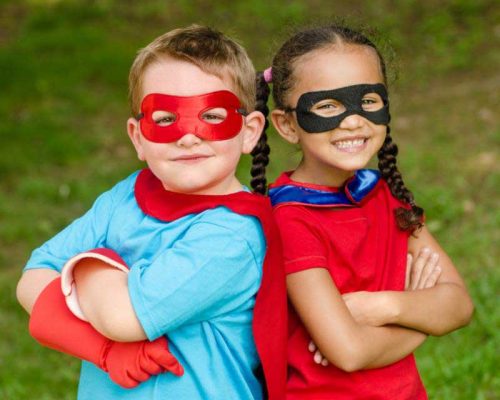 Boy & girl with superhero masks and capes - Autism Acceptance Month