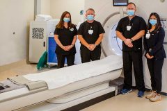 Some of Hamilton Medical Center’s CT technologists are pictured with the new Revolution CT unit. From left are Lisa Redmond, Kendall Black, James Bryant and Crystal Hernandez.