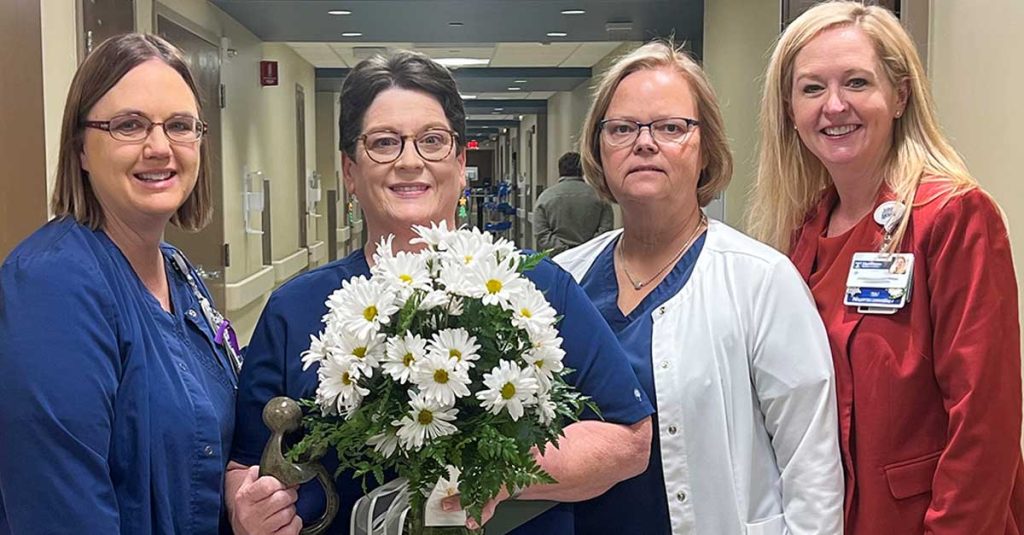 Donna Ivy, RN is a daisy award recipient pictured with nurse leadership